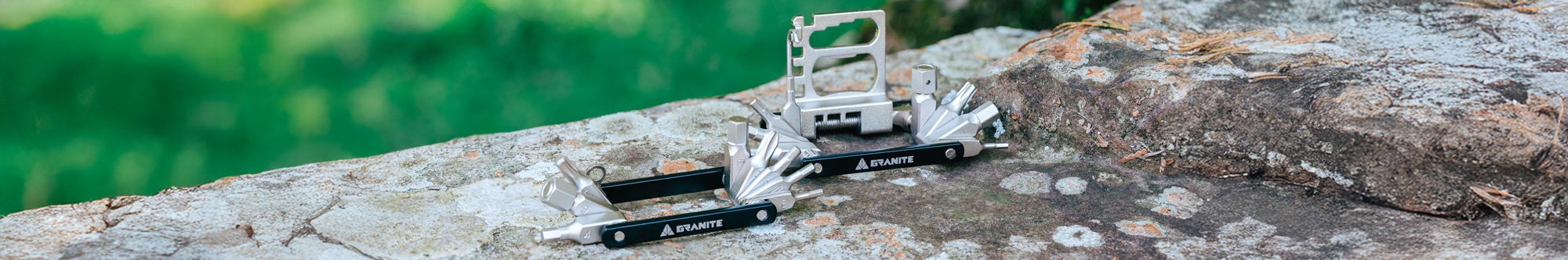 Granite Diverse 10 and 20 multi tool on a stone surface with a blurred green background