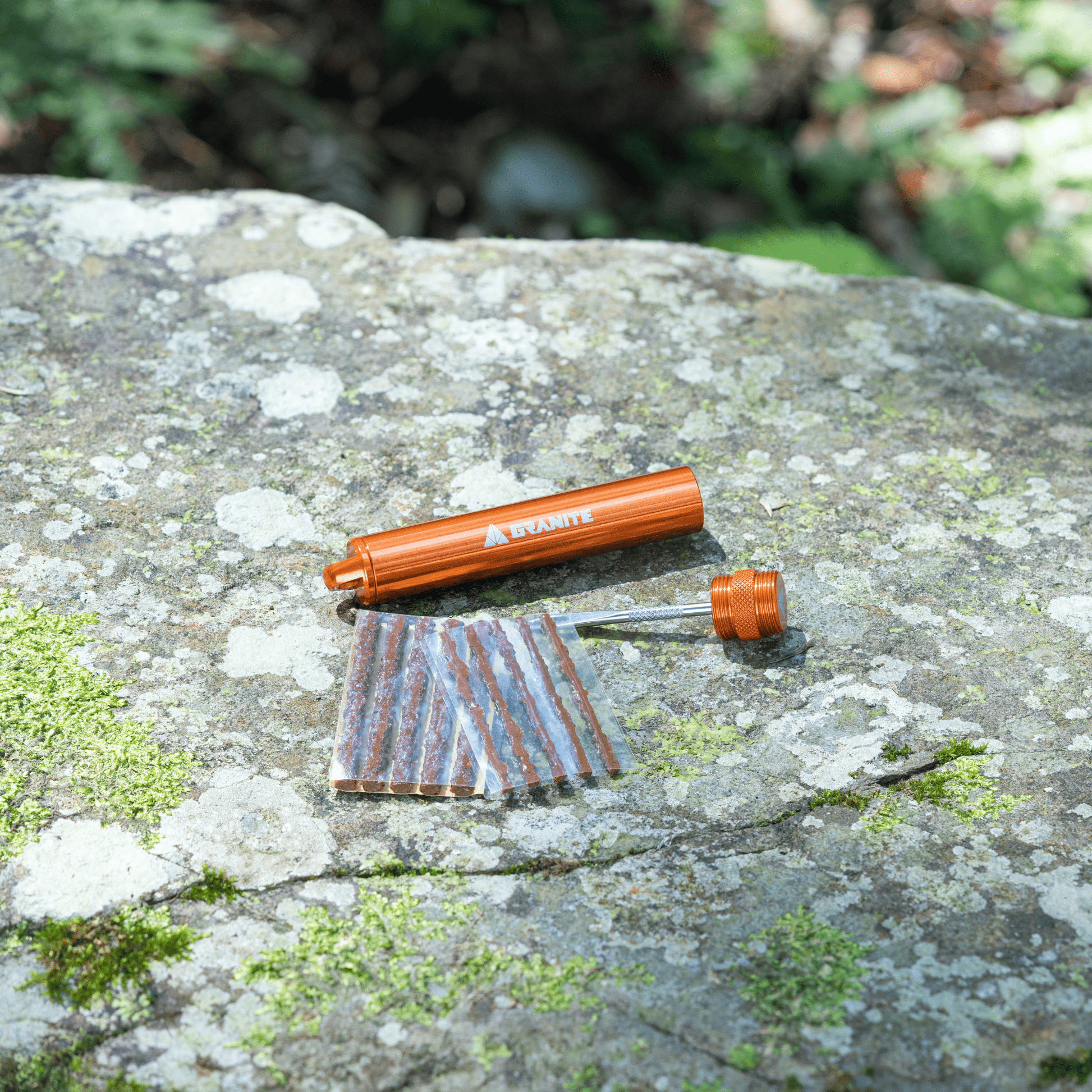 Granite Suture Tire Plug Kit Orange with Tire plug refill 10pcs on a rock
