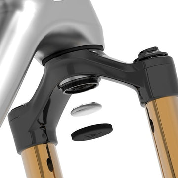 Close-up of a bike suspension fork's crown showing how Stash air tag mount assemble to it.