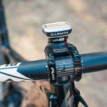 Garmin computer mounted on the Granite Scope Mount, securely attached to a Funn bike handlebar stem for clear visibility.