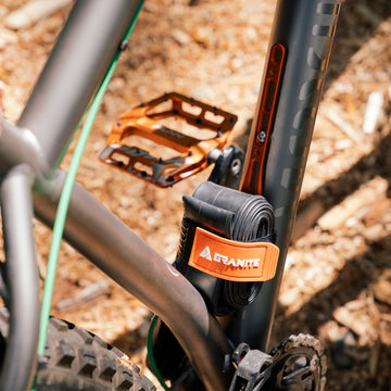 Granite portaledge XE strap kit with an spare inner tube attached to a bike bottle bosses, and mounting plate, for secure storage.