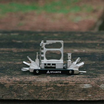 Granite Diverse 20 multi tool with its tools fanned out on a wooden board