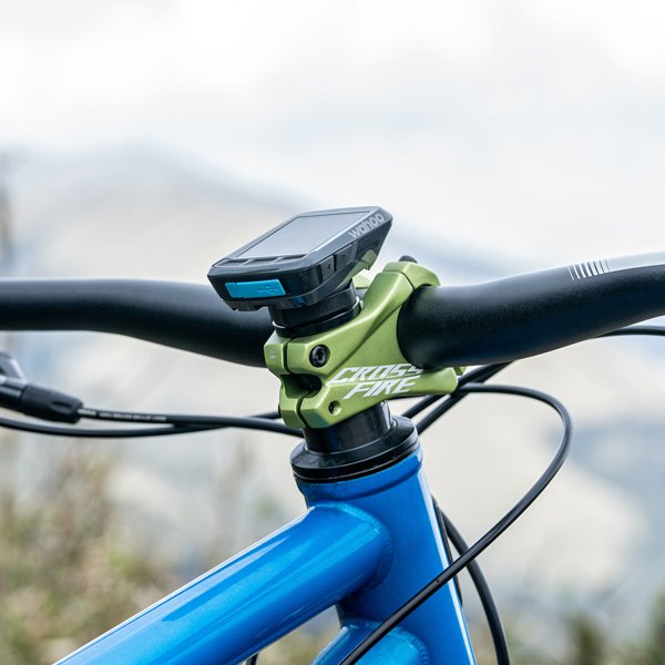 Wahoo bike computer mounted on a Stash RT multitool, offering streamlined navigation on a blue mountain bike.