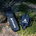 Granite Portaledge tool mounting strap and plate set on mossy rock surface for outdoor bike accessory storage.