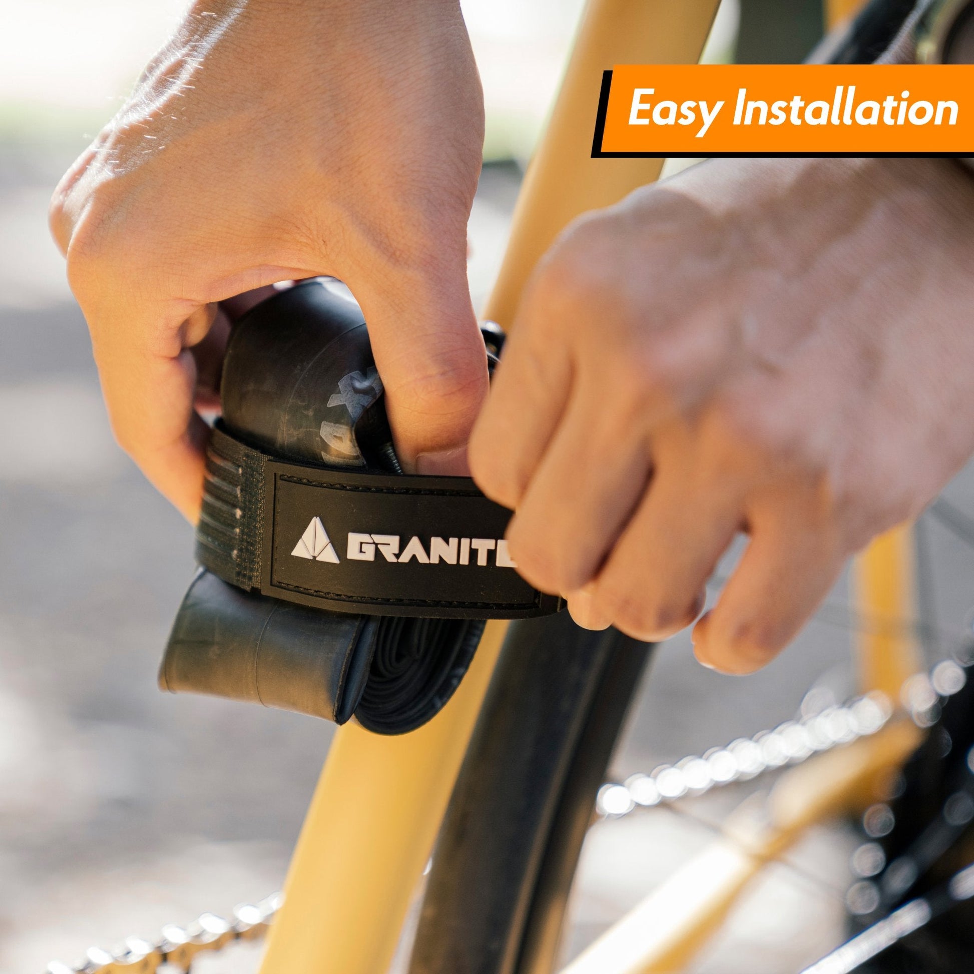 Granite Portaledge strap holding inner tube with easy installation on bike frame.