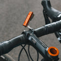 Granite RCX multitool attached to a bike handlebar stem, with the tool extended upward for easy access.