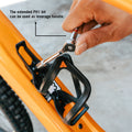 Person using the extended PH1 bit from Stash RT multitool as a leverage handle on a bike's bottle cage mount.